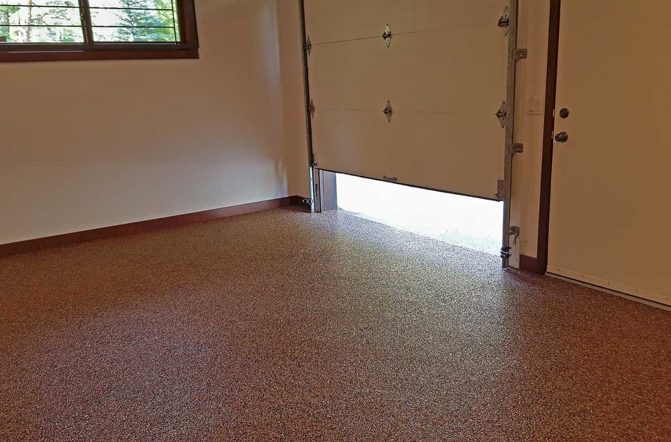 A sleek and shiny epoxy-coated garage floor installed by Expert Epoxy Solutions in a Leland, NC home, reflecting the professional quality and durability of the flooring.
