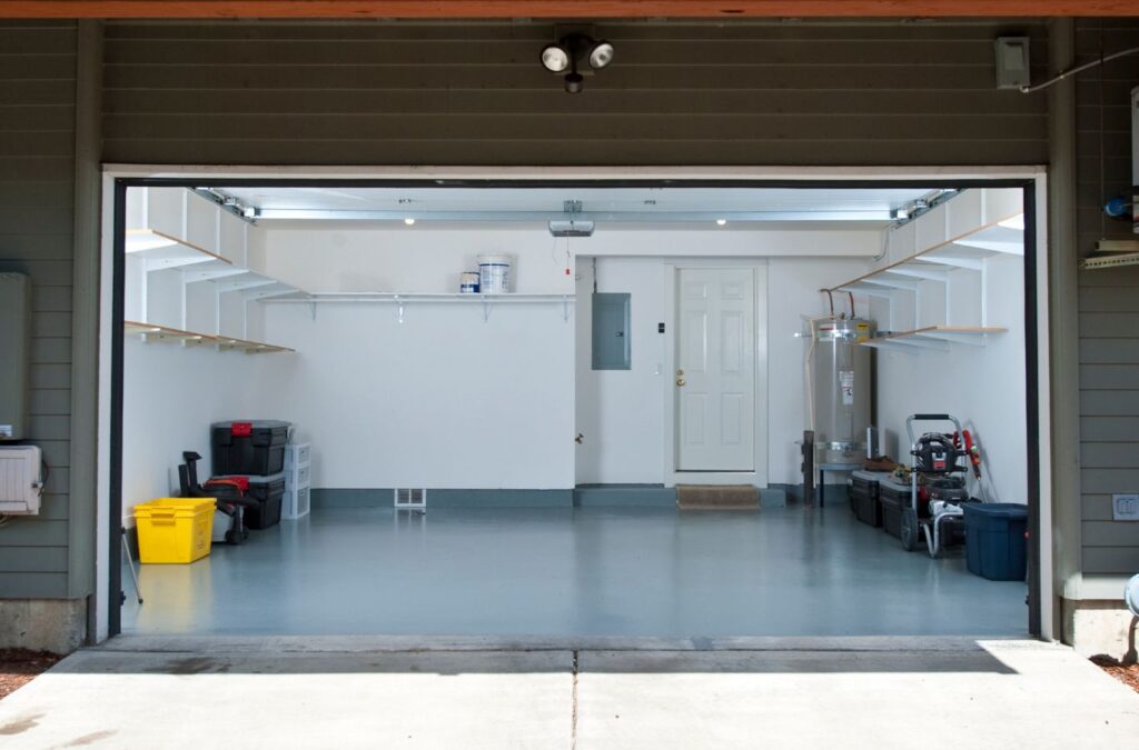 Expert Epoxy Solutions team member showcasing epoxy flooring installation, emphasizing the reasons to choose their services in Wilmington, NC. Garage Epoxy Flooring Near Me.