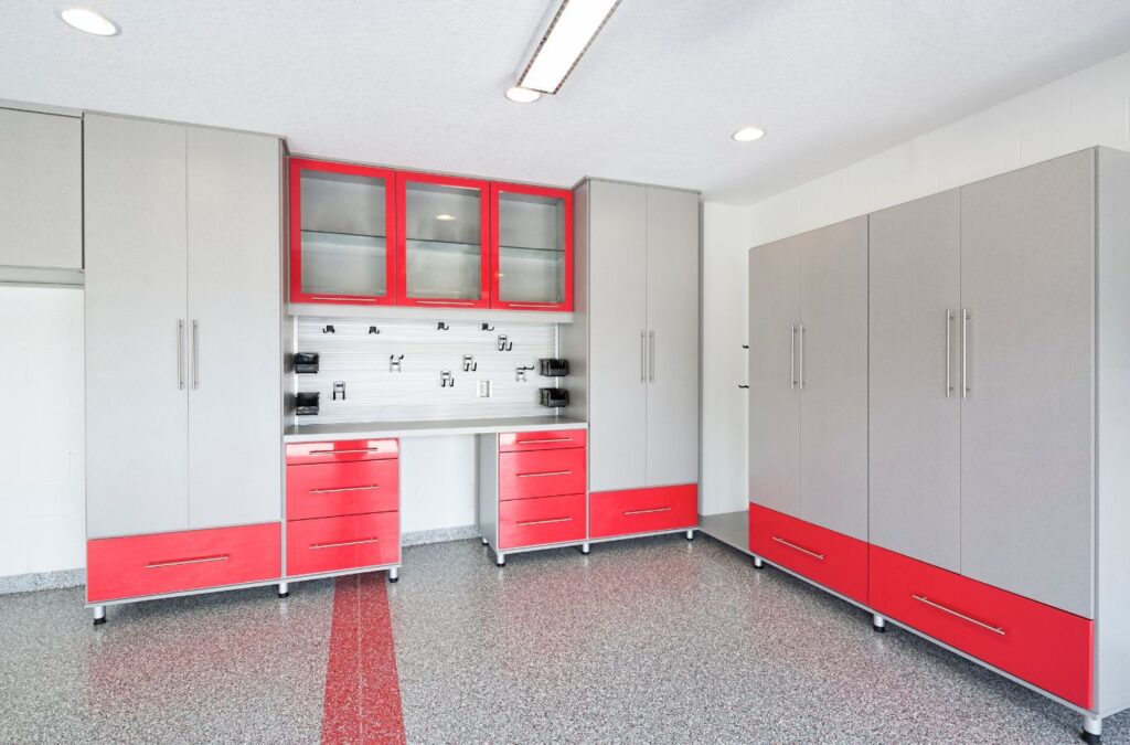 A technician demonstrating the benefits of garage epoxy flooring in Topsail Beach, NC, showcasing a seamless and durable finish.