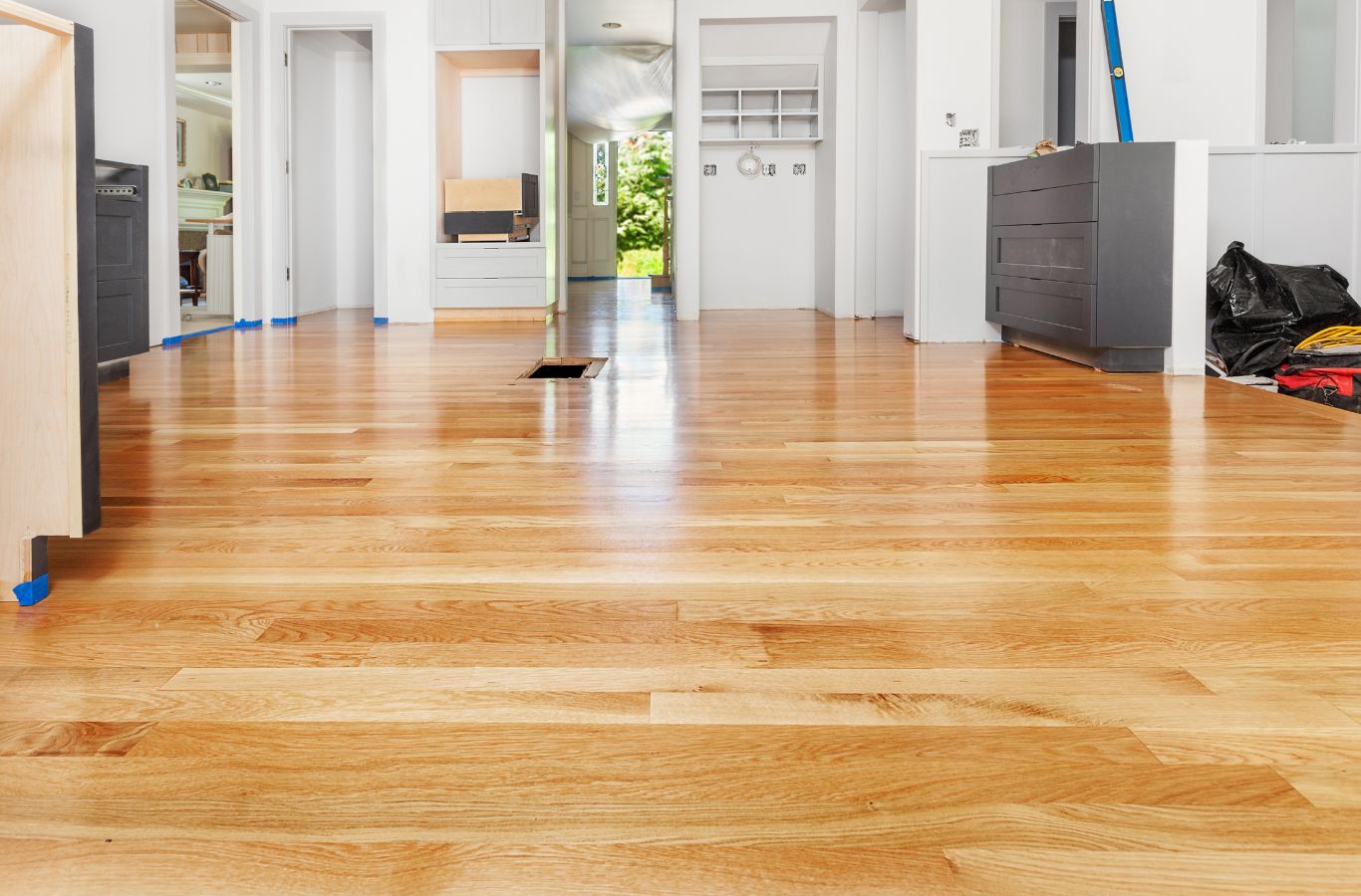 An expert from Expert Epoxy Solutions working on a residential epoxy floor in Topsail Beach, NC, highlighting the benefits of durability and style.