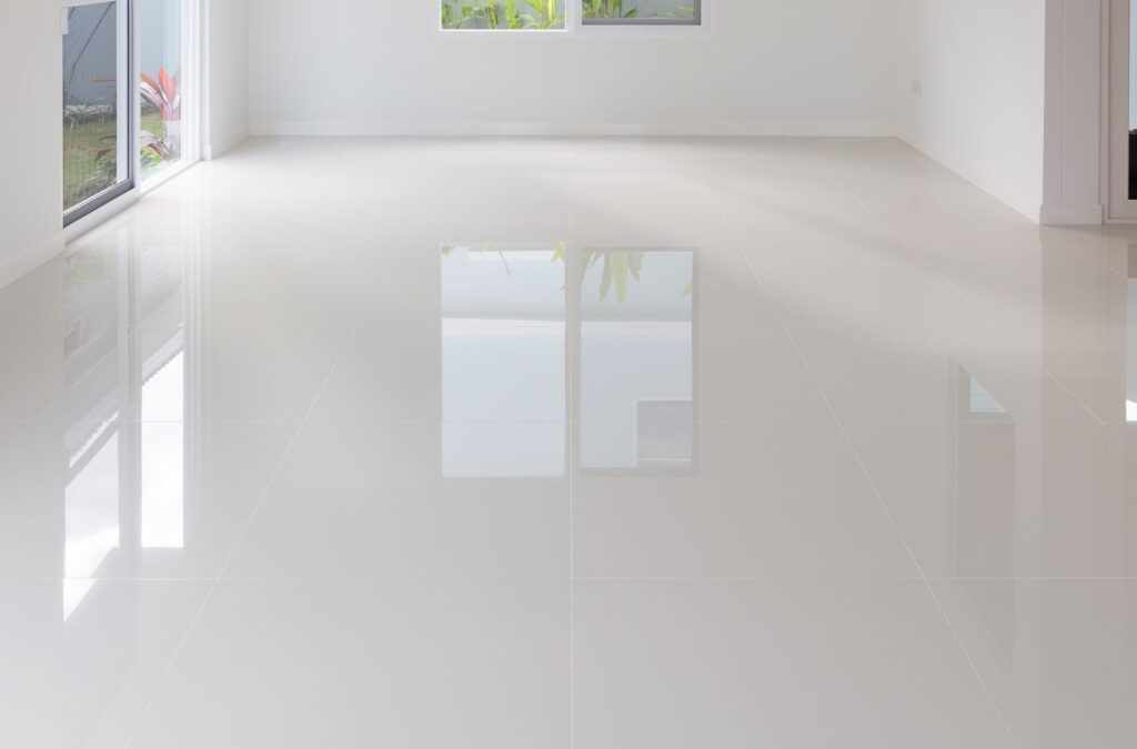 A technician from Expert Epoxy Solutions installing residential epoxy flooring in Topsail Beach, NC, using professional techniques for a flawless finish.