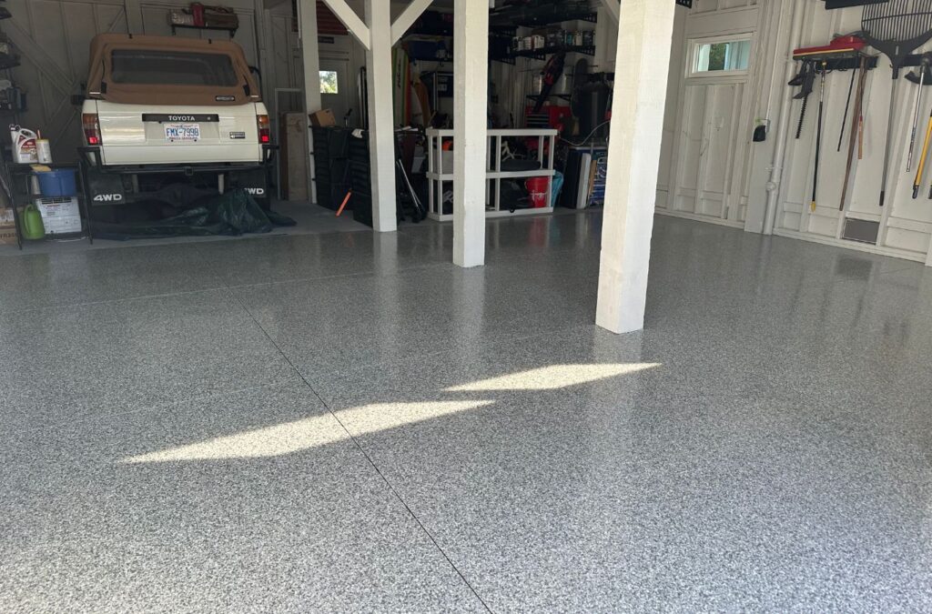 An Expert Epoxy Solutions specialist applying epoxy flooring in Hampstead, NC, showcasing local expertise and precision. Epoxy flooring near me.