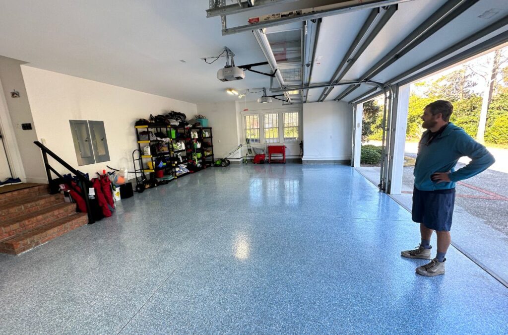 Expert Epoxy Solutions installing epoxy garage flooring in Castle Hayne, NC, showcasing high-quality materials and precision work.