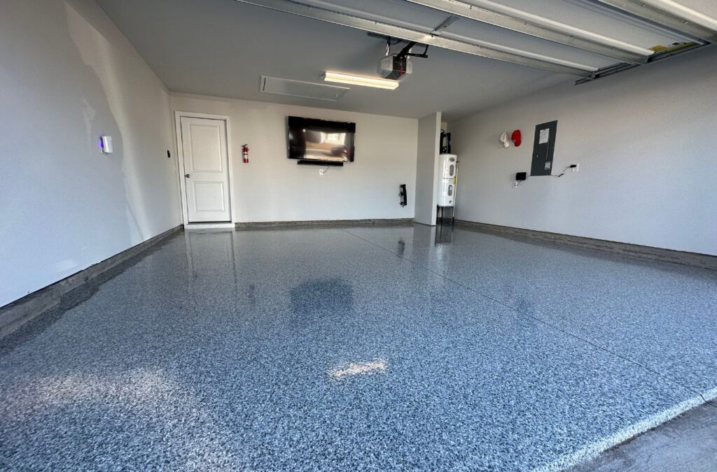 Expert Epoxy Solutions installing epoxy garage flooring in Hampstead, NC, ensuring precision and quality.